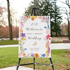 a welcome sign with flowers on it