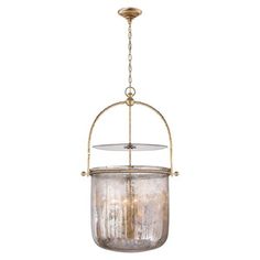 an old fashioned hanging light fixture with clear glass and gold metal frame, on a white background