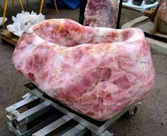 a large pink marble sculpture sitting on top of a pallet