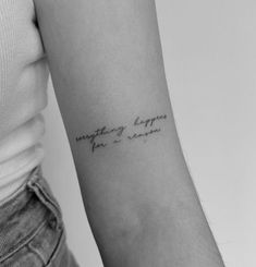 a woman with a tattoo on her arm saying something happens