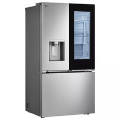 a silver refrigerator freezer sitting next to an icebox with its door open and water dispenser on the side