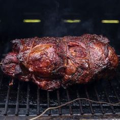 the meat is being cooked on the grill