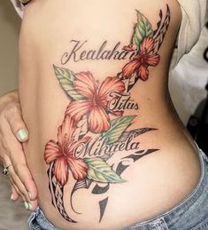 a woman's stomach with flowers on it and the words kealahaa tas written in cursive writing