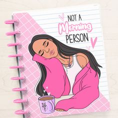 a notebook with a drawing of a woman holding a coffee cup