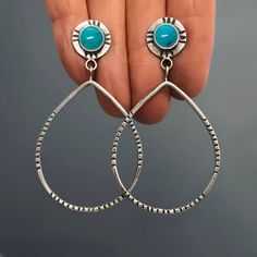 "These made-to-order turquoise hoop earrings are created from hand forged sterling silver and 8mm round turquoise stones. The hoops are teardrop shaped and stamped to reflect their shape. There are more hand stamped details around the turquoise stones. Having the stone set as a post at the top makes them feather light while still giving you a larger hoop to play with. The earrings in the pictures have sold and are pictured so you can see the earring design (and size). Made-to-order with turquois Nickel-free Turquoise Teardrop Hoop Earrings, Teardrop Turquoise Nickel-free Hoop Earrings, Nickel-free Teardrop Turquoise Hoop Earrings, Turquoise Teardrop Nickel-free Hoop Earrings, Turquoise Teardrop Hoop Earrings Nickel Free, Turquoise Teardrop Sterling Silver Hoop Earrings, Pmc Earrings, Teardrop Hoop Earrings, Oxidized Silver Rings