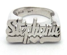 Let the world know who you are with this personalized name ring.  Written out in old school cursive with the tail of the last letter turning back to underline it all.  This ring has been handcrafted so the letters stand out in three dimensions.  This listing is for the name STEPHANIE.  Dimensions: size: 6 letters with underlining: 3/8" high x 7/8" wide (1 x 2.2 cm) band at bottom: 1/8" (3mm)  Please refer to my shop policies for shipping information.  I insure all items over $100.  I have several name rings currently available in my shop.  If you would like your own and your name is not represented, please send me a convo and I'll be happy to create one for you. Adjustable Engraved Ring With Polished Finish, Vintage Adjustable Personalized Initial Ring, Vintage Adjustable Initial Ring Personalized, Sterling Silver Engraved Ring With Initials, Silver Initial Ring With Polished Finish, Personalized Silver Ring With Name, Unique Sterling Silver Engraved Ring For Anniversary, Sterling Silver Symbolic Engraved Ring With Initials, Unique Engraved Ring With Polished Finish For Promise