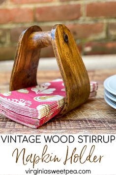 vintage wood stirrups are used to make napkin holders