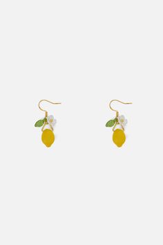 Lemon Earrings- A pair of cute fruity earrings- Lemon shaped charm- Hook ring- Hardware with a gold tone finish- Small leaf and flower detail Product Code: PWFY025 Cute Gold Earrings For Spring, Summer Fruit Design Earrings, Gold Fruit Design Drop Earrings, Gold Drop Earrings With Fruit Design, Trendy Fruit Design Drop Earrings, Lemon Earrings, Baby Outerwear, Small Leaf, Flower Detail