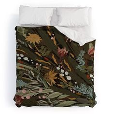 an image of a bed with flowers and plants on the comforter cover that has white pillows