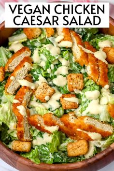 a salad with chicken and dressing in a bowl