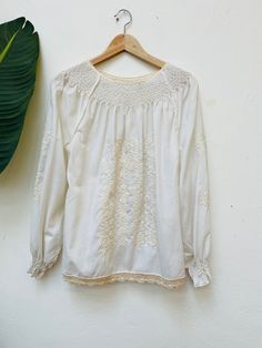 Please notice since we are a very small shop it's not possible for us to accept returns 🌼 Vintage Blouse from the 80s Große/ Size M/L Embroidery Length from Shoulder to hem: 64cm Length from Armpit to Armpit: 57cm comfy and ready to wear ! Condition : good vintage condition * We check our clothes before we send them to you 🌼 * Feel free to write us if You have any questions 🌼 *Please always check measurements before buying * If something went wrong and you are not happy with your order: pleas Folk Style Cream Top With Floral Embroidery, Folk Style Cream Tops With Floral Embroidery, Cream Folk Tops With Floral Embroidery, White Cotton Tops With Tonal Embroidery, Embroidered Off White Tops For Spring, Bohemian Off White Top With Floral Embroidery, Cream Cotton Tops With Intricate Embroidery, Off White Embroidered Top For Spring, Cotton Embroidered Long Sleeve Top With Lace Trim