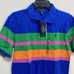 Brand New Never Worn With Tag Polo By Ralph Lauren Small Pony Collar Polo T Shirt Size: 18-20 (Extra Large)(Boy Size) Color: Blue/Green/Orange/Pink Gorgeous Color Combination Made In Guatemala Retail: $45 Excellent Giftable Item. 100% Authentic And New, So Buy With Confidence. Comes From Pets And Smoke Free Environment Thank You For Sharing And Your Visit Casual Blue Color Block T-shirt, Blue Crew Neck Polo Shirt For Summer, Fitted Blue Color Block T-shirt, Colorful Cotton Color Block Tops, Colorful Color Block Cotton Tops, Multicolor Cotton Crew Neck Polo Shirt, Spring Blue Color Block T-shirt, Blue Long-sleeve Polo Shirt For Summer, Blue Long Sleeve Polo Shirt For Summer