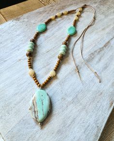 Adjustable necklace with natural stone pendant. Bohemian Hand-strung Amazonite Necklaces, Handmade Amazonite Bohemian Beaded Necklaces, Bohemian Handmade Amazonite Beaded Necklace, Handmade Bohemian Amazonite Beaded Necklace, Adjustable Bohemian Amazonite Beaded Necklace, Rustic Natural Stone Necklaces For Festivals, Bohemian Green Crystal Necklace For Beach, Hand-strung Bohemian Natural Jewelry, Bohemian Beaded Necklaces With Natural Stones