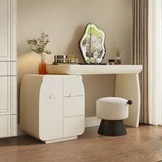 a dressing table with stool and mirror in the corner, next to a white cabinet