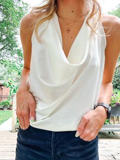 Ivory Satin Halter Top with a cowl neckline and fully adjustable straps for complete coverage. A simple way to add a sophisticated piece to your wardrobe. Elegant Summer Top With Cowl Neck, Elegant Spring Tops With Cowl Back, Elegant Camisole For Day Out, Elegant Cami Camisole For Day Out, Elegant Fitted Camisole For Day Out, Elegant White Spaghetti Strap Halter Top, Chic White Halter Top, Elegant Cream Camisole Tank Top, Elegant Fitted Cream Tank Top