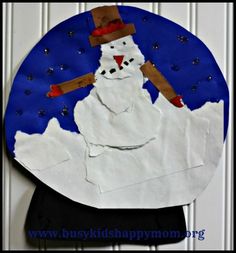 a paper plate that has a snowman on it and is made with construction paper