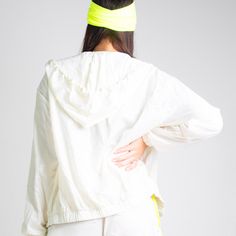 The Runner Island White Sands Windbreaker Jacket features a hood with adjustable toggle drawstrings, a contrasting neon yellow front zipper, and water-resistant Tafetta making it perfect for running under a little drizzle or a steamy morning tennis match. 100% Polyester Zipper closure Hooded Windbreaker Water Resistant Model wears size small True to women's sizing Full Zip & Toggle Drawstring 2 Pockets & Long Sleeves: Stay warm and keep your cell phone, car key or house key at reach while runnin Tennis Match, Running Jacket, White Sand, Neon Yellow, Windbreaker Jacket, Running Errands, Stay Warm, Front Zipper, Elastic Waist