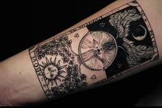 a black and white tattoo on the arm of a person with a clock in it