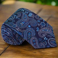 Elevate Your Style with the Sophisticated Dark Blue Paisley Pattern Necktie Unveil sophistication and refinement with our Dark Blue Paisley Pattern Necktie, an embodiment of timeless elegance and impeccable craftsmanship. Available in both 3.4" and 2.5" widths, and regular or extra-long lengths, this necktie seamlessly blends classic charm with contemporary style. 1. Subtle Yet Striking Design: A Fusion of Hues Intricately designed with a fusion of dark blue hues and hints of purple, adorned wit Blue Paisley Print Ties For Business, Elegant Business Suit And Tie Accessories With Paisley Print, Blue Paisley Print Business Ties, Business Suit And Tie Accessories With Paisley Print, Elegant Blue Ties, Elegant Paisley Print Neckwear For Business, Elegant Blue Neckwear With Ties, Elegant Semi-formal Ties With Paisley Print, Elegant Patterned Standard Tie