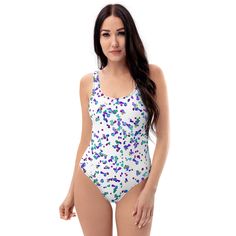 This swimsuit design i call " speckles on white" , reflects the sun well , keeping you cool by the pool. * 82% Polyester, 18% Spandex * Fabric weight: 6.78 oz/yd² (230 g/m weight may vary by 5% * Chlorine-resistant fabric * Cheeky fit with a scoop neckline and a low scoop back * Zig-zag stitching * Double-layer front  * Four-way stretch material stretches and recovers on the cross and lengthwise grains White Swimwear With Uv Protection For Pool, White Uv Protection Swimwear For Pool, White Swimwear With Uv Protection For Sunbathing, White Swimwear With Uv Protection For Spring, White Spring Swimwear For Swimming, White Sports Swimwear For Spring, White One Piece Swimsuit, White One Piece, Swimsuit Design