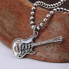 Sterling Silver Guitar Necklace - Jewelry1000.com Silver Metal Necklace For Concert, Silver Metal Jewelry For Concerts, Silver Music-themed Metal Necklace, Nickel-free Silver Jewelry For Concerts, Silver Music-themed Metal Jewelry, Music-themed Silver Metal Jewelry, Trendy Metal Jewelry For Concerts, Silver Chain Necklace For Concert, Silver Necklace For Concert