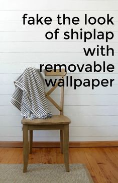 a chair with a blanket on it and the words fake the look of shiplap with removable wallpaper