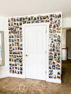 a white door sitting inside of a room next to a wall with pictures on it