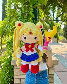 a woman holding a stuffed animal in her hands