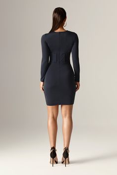 Introducing the 'Renata' Mini Dress —a bold take on the classic mini. Crafted from a soft Rayon blend with plenty of stretch, it hugs your curves for a perfect body-con fit. The corseted bodice cinches the waist, while the crisscross neckline adds a playful touch. Flirty in length and effortlessly chic, it’s ideal for transitioning between seasons. Complete with a back zip and stretch Lycra lining, it ensures a smooth fit for all bust sizes. Pair with heels for a statement look. Where To Wear:Ro V-neck Stretch Mini Dress For Evening, Ruched Dress Bodycon, Glamorous Stretch V-neck Mini Dress, Chic V-neck Mini Dress With Side Zipper, Stretch Mini Dress With Back Zipper And V-neck, Stretch V-neck Midi Dress With Back Zipper, Cocktail Dress Formal, Jumpsuit And Blazer, Maxi Gown Dress