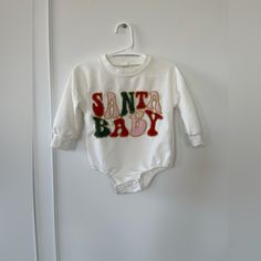 Santa Baby Long Sleeve Onesie Never Worn Very Nice And Thick Material Size 6m Christmas Baby Onesie, White Long Sleeve Christmas Onesie, Santa Baby Sweater, Christmas Playtime Long Sleeve Onesie, Christmas Long-sleeve Playtime Onesie, Baby Long Sleeve, Long Sleeve Onesie, Santa Baby, Baby Sweaters