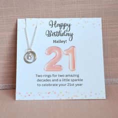 A special 21st birthday necklace. The perfect gift for a daughter, friend, granddaughter, niece or cousin. All wrapped and ready for gifting! The necklace comes on a personalized jewelry card for a unique touch. Sure to become her new favorite necklace.  Two HANDMADE sterling silver rings, linked together. A sparkly tiny cubic zirconia stone is added to the middle. This is such a pretty and stylish necklace. She will cherish it forever.  Includes the jewelry message card that reads: Happy Birthd Silver Birthstone Necklace For Birthday, Silver Charm Necklaces For Birthday, Birthday For Daughter, Birthday 21st, Favorite Necklace, Birthday Necklace, Happy Birthday Name, Handmade Sterling Silver Rings, 21st Birthday Gifts