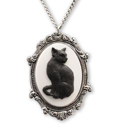 PRICES MAY VARY. Beautifully crafted black cat cameo, black on white Frame made out of high grade pewter with an anti-tarnish silver finish Two color resin cameo in a silver antique finish frame Pendant size is 2 1/4 inches long x 1 1/2 inches wide on a 20 inch neck chain Hand crafted and MADE IN USA This beautifully fashioned twenty inch necklace and pendant is a unique piece. The pendant is cast in fine pewter and plated with an anti-tarnish silver finish. All of our necklaces are hand crafted Harajuku Accessories, Black Cat Jewelry, Satanic Clothing, Black Cat Necklace, Cameo Pendant Necklace, Gothic Pendant, Cats Diy Projects, Pewter Jewelry, Cameo Jewelry