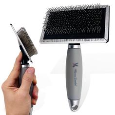 a person holding a brush and comb in front of a hair dryer on a white background