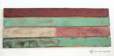 an old wooden flag painted red, white and green with the colors of the american flag