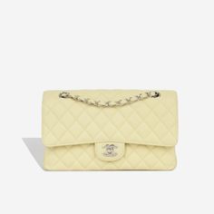 For timeless Parisian-chic there is no better investment than a Chanel classic flap bag. Created in a beautiful pale yellow caviar leather, in the coveted Medium size. This Chanel comes with all the iconic features including multiple compartments and pockets. The interwoven chain sits elegantly on your shoulder or doubled up on your arm. SPL Exterior Pale yellow caviar leather Silver tone hardware CC twistlock closure Slip pocket at rear of bag 2018 production Excellent condition - some light corner wear and hairline scratches to CC Interior Yellow leather interior Double flap Zip compartment on first flap Two slip pockets at interior wall Excellent condition - one small mark under second flap Sold with box and dustbag only SPL Height 16cm Width 26cm Depth 7cm Chanel Classic Flap Bag, Classic Flap Bag, Yellow Leather, Parisian Chic, Timeless Handbag, Leather Silver, Classic Flap, Pale Yellow, Exclusive Bag