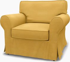 a chair with a yellow cover on it and a black leg rests in front of the chair