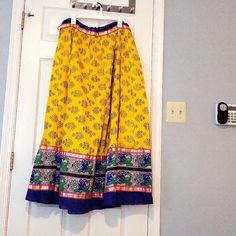 This Is A Gorgeous Ethnic Skirt With Gold Foil Print All Over Front And Back. The Border Has Contrast Lace And Zari Threadwork On All Sides. Its A Free Size Skirt Since It Has A Dori On The Inside For Tying It As Per Your Size And Comfort. From A Smoke And Pet Free Home. Traditional Long Yellow Skirt, Festive Yellow Long Skirt, Traditional Yellow Summer Skirt, Traditional Yellow Skirt For Summer, Traditional Yellow Festive Skirt, Traditional Yellow Skirt For Festive Occasions, Yellow Long Skirt For Festival, Gold Foil Print, Indian Ethnic Wear