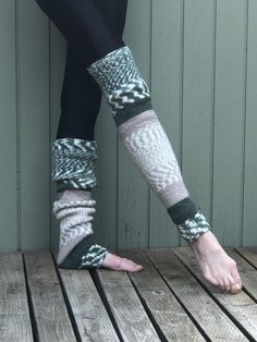 These hand knit over the knee/thigh high leg warmers will soon be your favorite.  Wear them over tights, with your shorts or under track pants.  They are long enough to pull over the knee, or slouched down over cold feet.  Perfect accessory for the cold fall and winter months.    Wear them to your yoga, Pilates or ballet class.   Hand knit from a warm and cozy yarn of 80% acrylic and 20% wool in solid and fair isle stripes of  forest green, tan,  and cream. Color placement varies n each pair.  The pair received may be slightly different than pictured.  Measures approximately  25" in length, 12" at the knee and 8" at ankle.  Measurements taken flat before stretching.  Model is 5' 9" and wears a size 2/4.  Best fits a small/medium.   Machine wash warm, tumble dry low or hand wash and dry fla Leg Warmers Ballet, Ballet Leg Warmers, Long Leg Warmers, Thigh High Leg Warmers, Ballet Class, Winter Months, Socks And Hosiery, High Leg, Long Legs