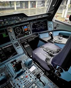 the inside of an airplane cockpit with multiple controls and dashboards on it's sides