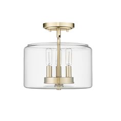 a glass and brass ceiling light with three lights