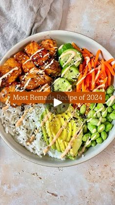 a white bowl filled with rice and vegetables