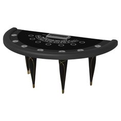 a black and white table with legs that are shaped like a casino chip, which has an electronic device on top