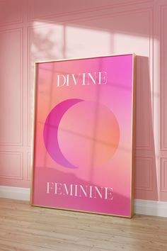 a pink poster with the words divine feminine on it in front of a pink wall