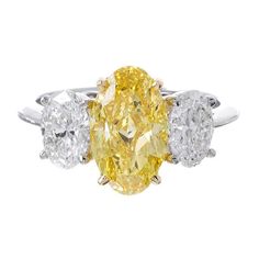 This lovely canary diamond engagement ring features a 1.50 Ct. natural fancy yellow oval cut diamond with VS1 clarity. Metal : 14K Two Tone, 18K Two Tone, Solid Platinum/18K Yellow Gold Setting Type : Prong Total Carat Weight : 2.00 Carats Type : Natural Genuine Diamond Shape : Oval Cut Carat Weight : 1.50 Ct. (GIA Certified) GIA Certification : Included, Contact us to get the copy! Cut Quality : Excellent Color : Canary Fancy Yellow Natural Clarity : VS1 Type : Natural Genuine Diamonds Shape : Canary Diamond Engagement Ring, Oval Cut Diamond Rings, 3 Stone Diamond Ring, Canary Diamond, Yellow Diamonds Engagement, Yellow Diamond Engagement Ring, Diamond Rings With Price, Oval Diamond Ring, Beautiful Diamond Rings