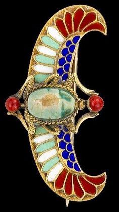 a brooch with an image of a bird on it's back and the letter c in red, white, and blue