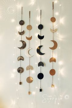 a wall hanging with different types of moon and crescents on it's sides