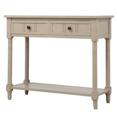 a white console table with two drawers