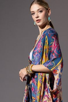 Introducing our Lightweight stylish Kimono, a captivating combination of geometric, floral, and paisley patterns for an eye-catching ensemble. 100% Viscose *APPROX. L 38" W 40" Bohemian Patterned Kimono With Vibrant Print, Chic Multicolor Floral Print Kimono, Elegant Multicolor Printed Kimono, Colorful Patterned Spring Kimono, Fitted Floral Print Kimono, Fitted Floral Kimono For Festival, Bohemian Multicolor Floral Print Kimono, Casual Spring Paisley Print Kimono, Fitted Printed Bohemian Kimono