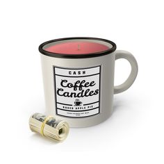 a coffee mug with a candle in it next to a roll of wax on a white background