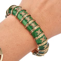 Be amazed by this vintage 1930's green Enamel 18K Yellow Gold flexible snake Bracelet. The green Paillonne enamel shine with every movement. Elegant Hand-carved engraving of the gold detailing enhances this bracelet's eye-catching effect. For security, this 79.2-gram bracelet has two two safety clasp for securing. Measurements: 17 mm width X 7.0 Inches Weight: 98.2 Grams Clasp: Insert Clasp Condition: Excellent Accompanied by an official appraisal document. Green Enamel Bangle, Snake Green, Two Two, 18k Gold Bracelet, Yellow Gold Wedding Band, Snake Bracelet, Jewelry Appraisal, Green Enamel, Gems Jewelry